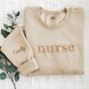 Picture of Embroidered Nurse Sweatshirt, Nurse Hoodie, Nurse Pullover, New Nurse Gift With Custom Name On Sleeve, Nursing School Shirt, Gift for her