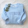Picture of Embroidered Nurse Sweatshirt, Nurse Hoodie, Nurse Pullover, New Nurse Gift With Custom Name On Sleeve, Nursing School Shirt, Gift for her