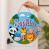 Picture of Personalized Safari Name Sign, Custom Jungle Animal Door Hanger, Kids Room Nursery Wall Decor, Baby Girl Nursery Gift, Round Wood Sign Hang