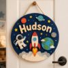 Picture of Personalized Space Name Sign, Custom Rocket Door Hanger, Astronaut Kids Room Decor, Outer Space Nursery Wall Art, Round Wood Baby Gift