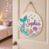 Picture of Personalized Mermaid Tail Name Sign, Custom Girls Room Door Hanger, Under The Sea Nursery Wall Decor, Ocean Baby Gift, Round Wood Sign