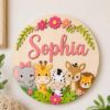 Picture of Personalized Safari Girl Name Sign, Custom Jungle Animal Door Hanger, Baby Girl Nursery Wall Decor, Kids Bedroom Door Gift, Round Wood Sign