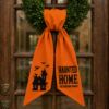 Picture of Personalized Haunted Home Wreath Sash Bow, Custom Family Name Halloween Wreath Bow, Embroidered Haunted House Door Hanger, Spooky Door Decor