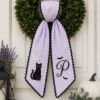 Picture of Personalized Black Cat Halloween Wreath Sash, Custom Monogram Door Bow, Embroidered Spooky Front Door Decor, Purple Halloween Ribbon