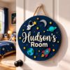 Picture of Personalized Space Name Sign, Custom Kids Room Door Hanger, Astronaut Rocket Nursery Wall Decor, Boys Bedroom Gift, Round Wood Sign Boy